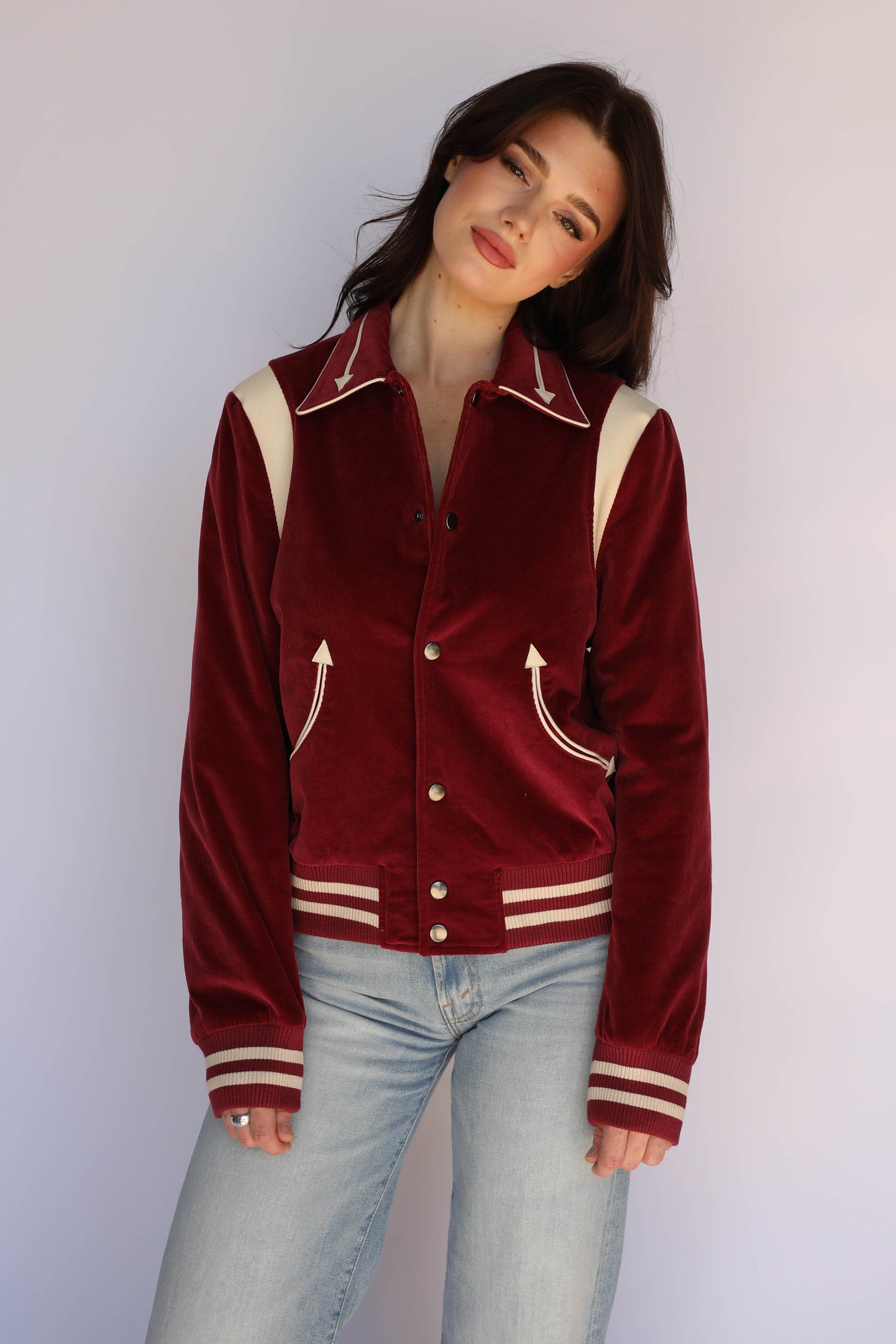 Front view of the H Bar C Silver Lake maroon corduroy jacket on a woman, with cream lambskin shoulder panels.