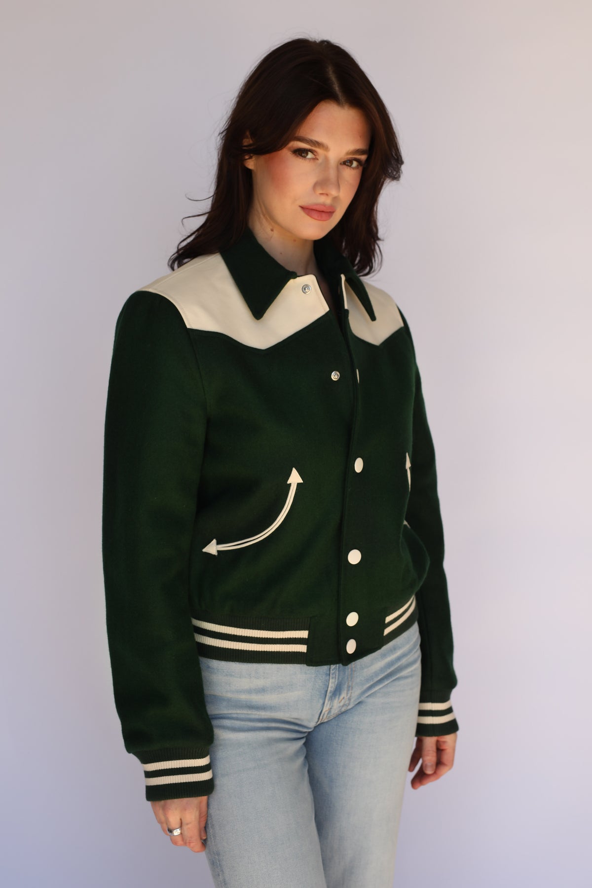 Front view of The Vail H Bar C green western jacket on a woman.