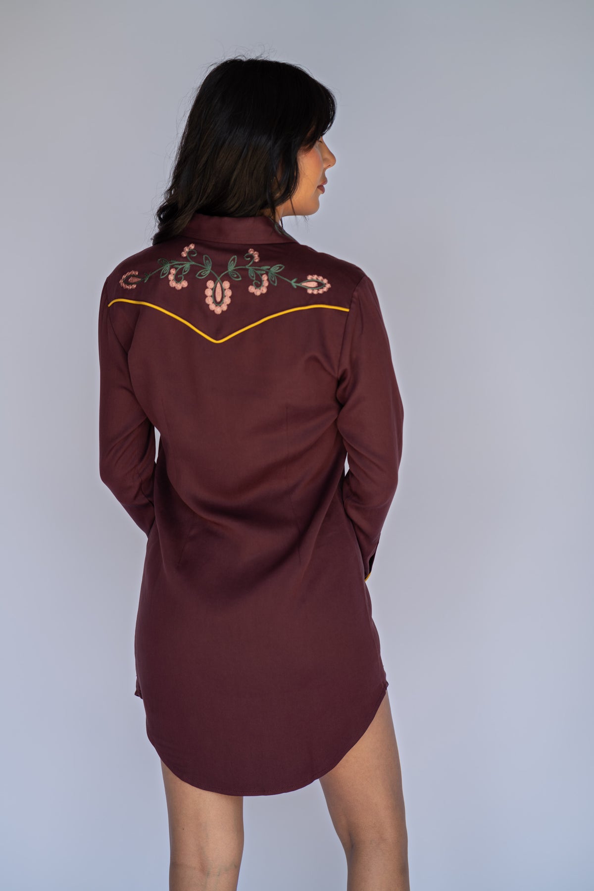 Back view of the H Bar C Sedona maroon dress with floral embroidery across the shoulders.