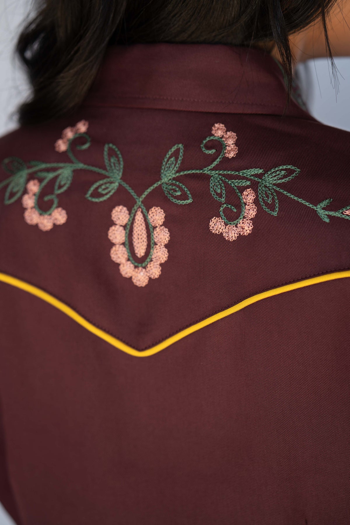 Close-up of the pink and green floral embroidery on the back yoke of the H Bar C Sedona dress.