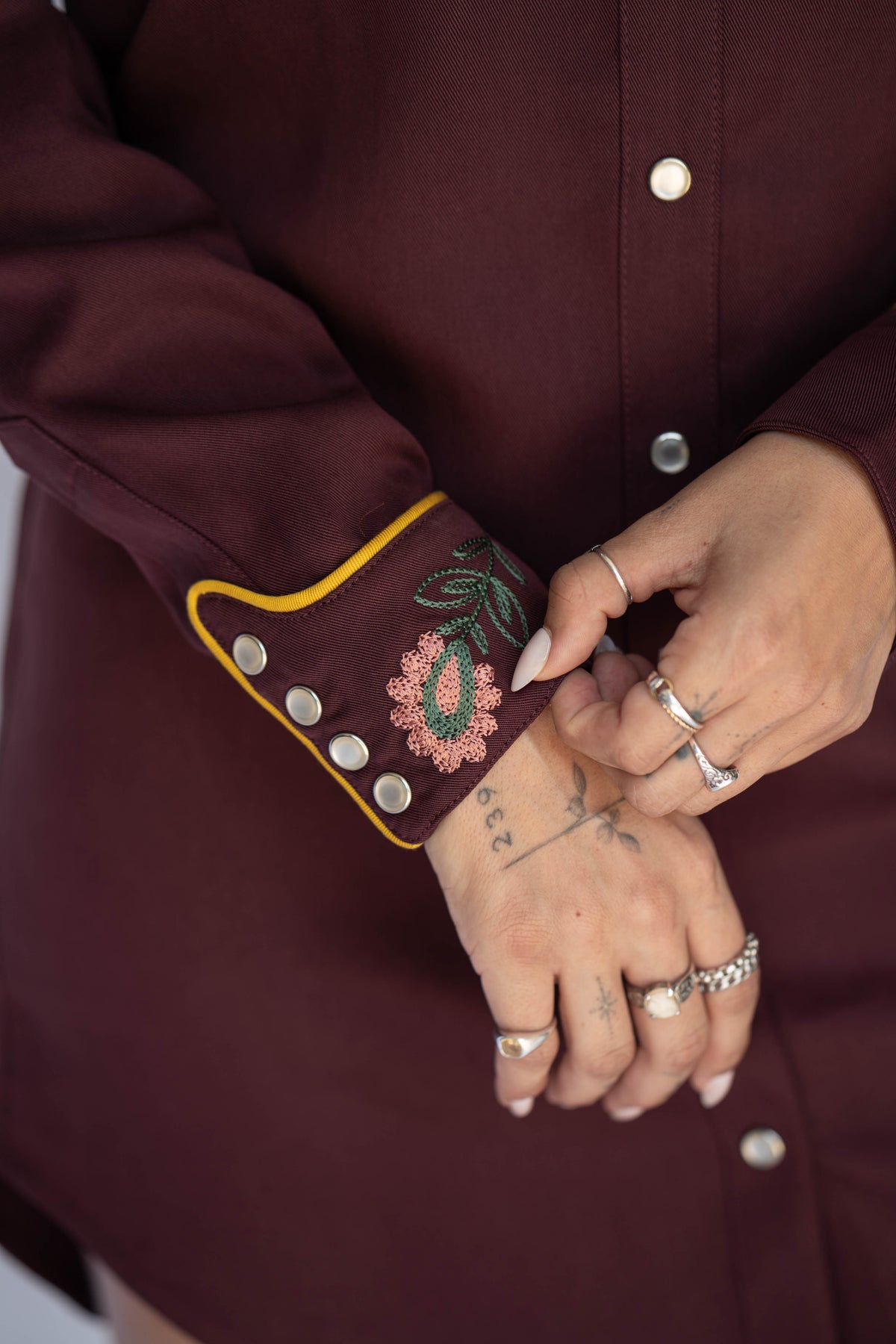 Embroidered snap cuff detail on the H Bar C Sedona maroon western dress.