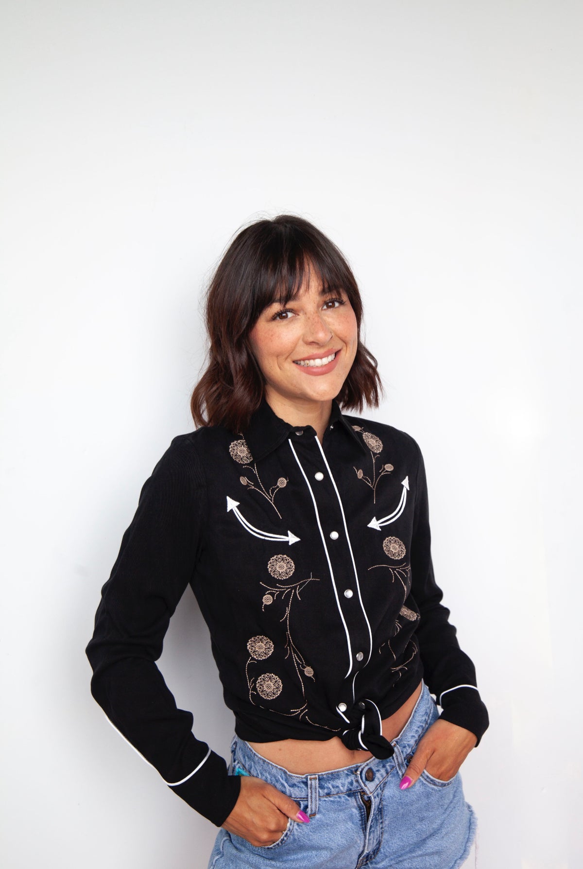 Model in the HBarC x Gibson J-200 Tencel shirt with chain stitch inspired by the Gibson J-200 guitar.