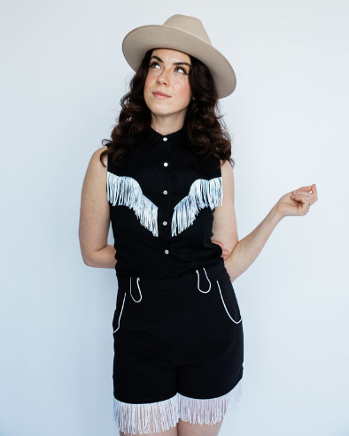Model in the H Bar C Marfa black fringe shorts and matching Tulsa top.