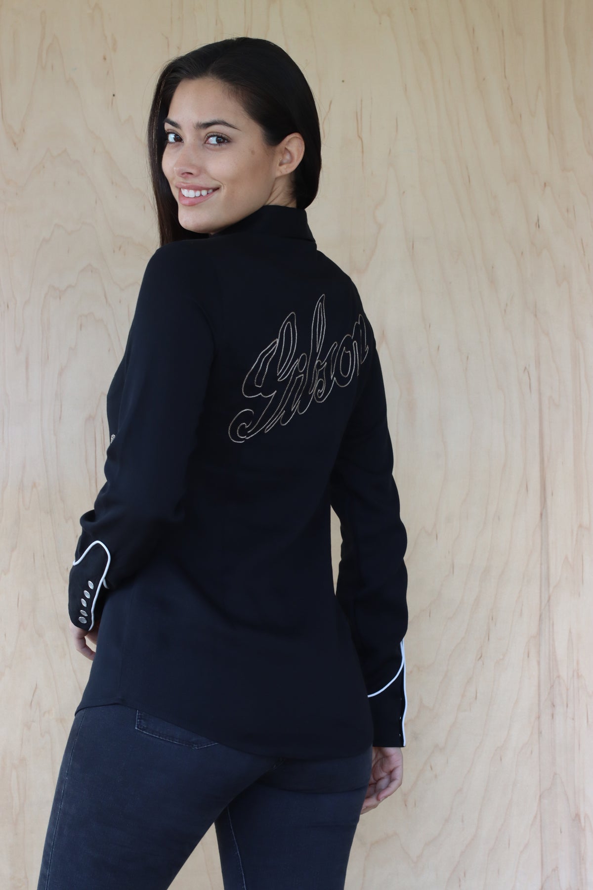 Three-quarter back view of the HBarC x Gibson J-200 women's shirt with Gibson script on the back.