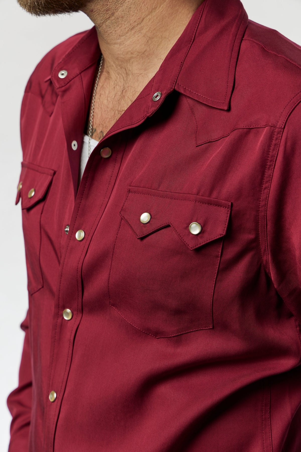 Close-up of the sawtooth pocket and snaps on the H Bar C Kansas City wine western shirt.