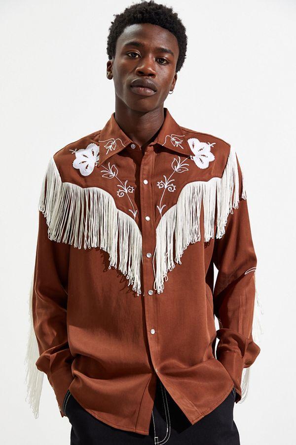 Man wearing the H Bar C Taos men's shirt in brown with white fringe and white floral embroidery on the yokes.